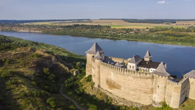 Aerial view of old castle near the River. Hotyn Castle in Ukraine. Eastern Europe. Hyperlapse.