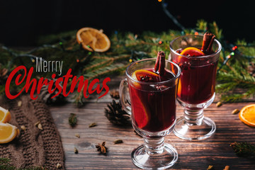greeting card with warm and spicy mulled wine in glasses with the inscription Merry Christmas
