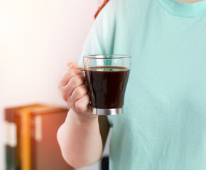 woman hand holding a coffee cup