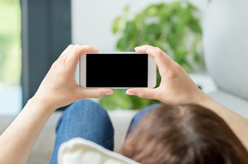 woman hands watching media in a smart phone