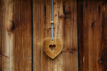 Wooden heart for happiness on wooden doors