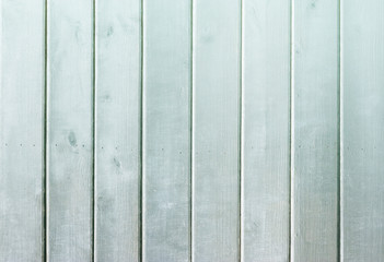 Light-blue wooden background. Blue faded painted wooden texture, background, wallpaper. Wooden background, painted surface blue boards.  Weathered blue wood background texture. Vertical  planks