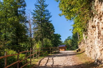 Fototapeta na wymiar Path through forest by the stone in Jajce/Bosnia and Herzegovina