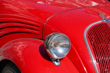 classic car headlamp and grill detail