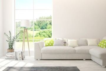 Stylish room in white color with sofa and summer landscape in window. Scandinavian interior design. 3D illustration