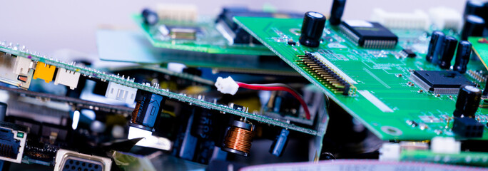 electronic PCB garbage as background from recycle industry and old consumer devices - obrazy, fototapety, plakaty