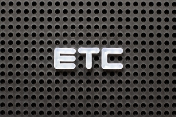 Black color pegboard with white letter in word etc (abbreviation of et cetera)