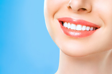 Fototapeta premium Perfect healthy teeth smile of a young woman. Teeth whitening. Dental clinic patient. Stomatology concept.