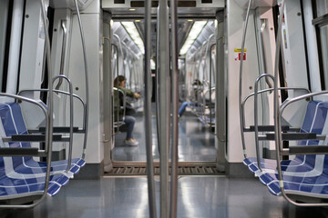 Interior of a modern and empty subway car.