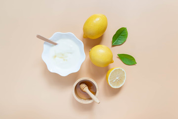 Perfect homemade natural face mask ingredients for bright and healthy skin. Top view of yogurt,...