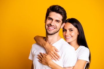 Photo of amazing pair in love posing for family portrait piggyback wear casual white t-shirts isolated yellow color background