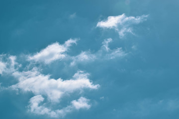 White clouds, on the blue sky, background