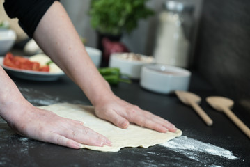making homemade Italian-style pizza