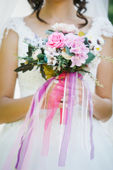 a bride is holding her flowers on her wedding
