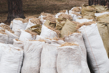 hay in bags, dried grass, cleaning