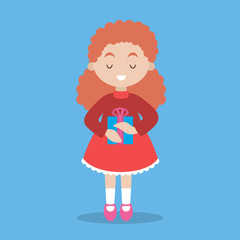 Happy girl child in red dress holding gift box