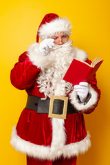 Santa Claus reading a novel