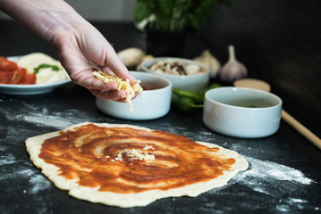 making homemade Italian-style pizza