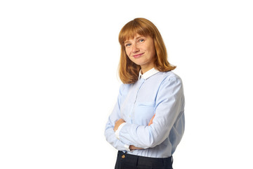 Headshot of young female model with ginger hair and freckles dressed in blue shirt looking at the camera. Isolated on white background