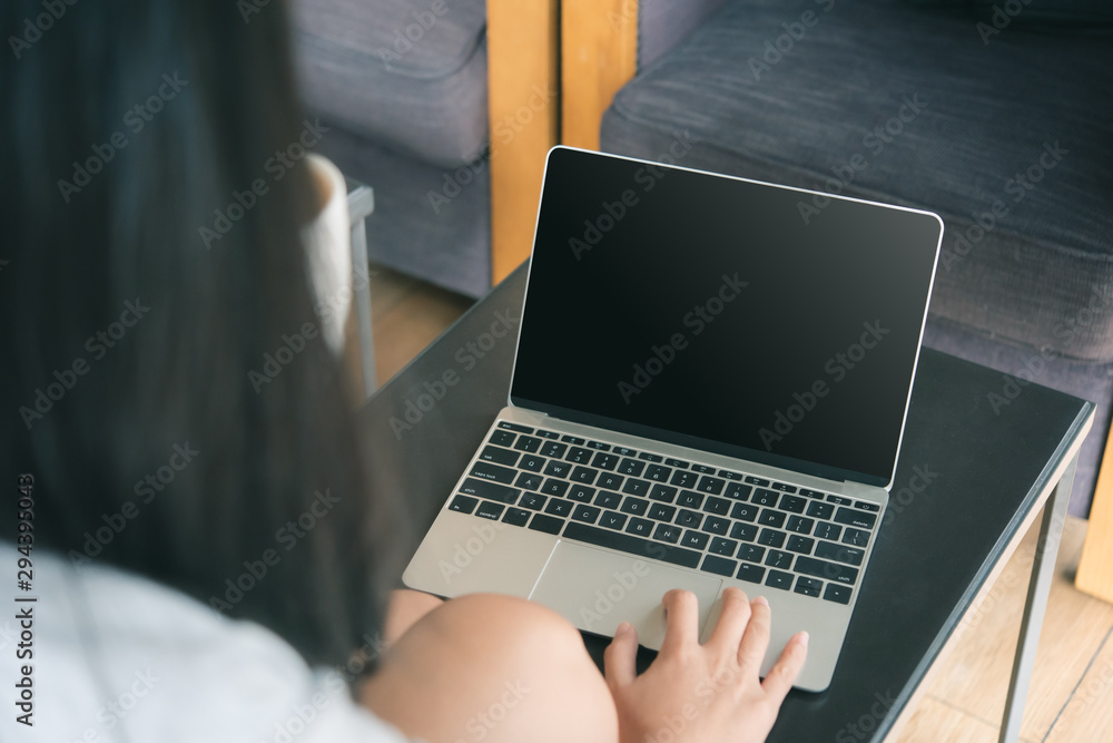 Poster business woman working on computer with empty blank screen in the coffee shop, concept freedom of wo