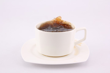 coffee splash from a cup isolated on white background.