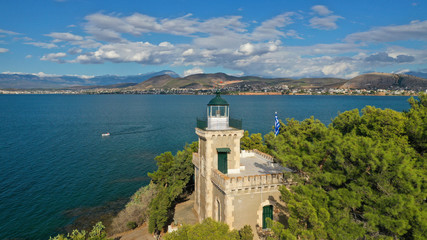 Naklejka premium Aerial drone photo of iconic lighthouse built in small islet in famous city of Halkida or Chalkida with clear water seascape and beautiful sky - clouds, Evia island, Greece