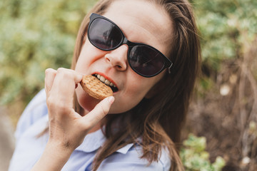 Fototapeta na wymiar Woman eating a cereal biscuit