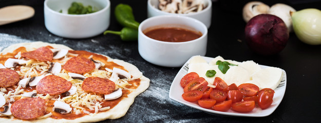 making homemade Italian-style pizza