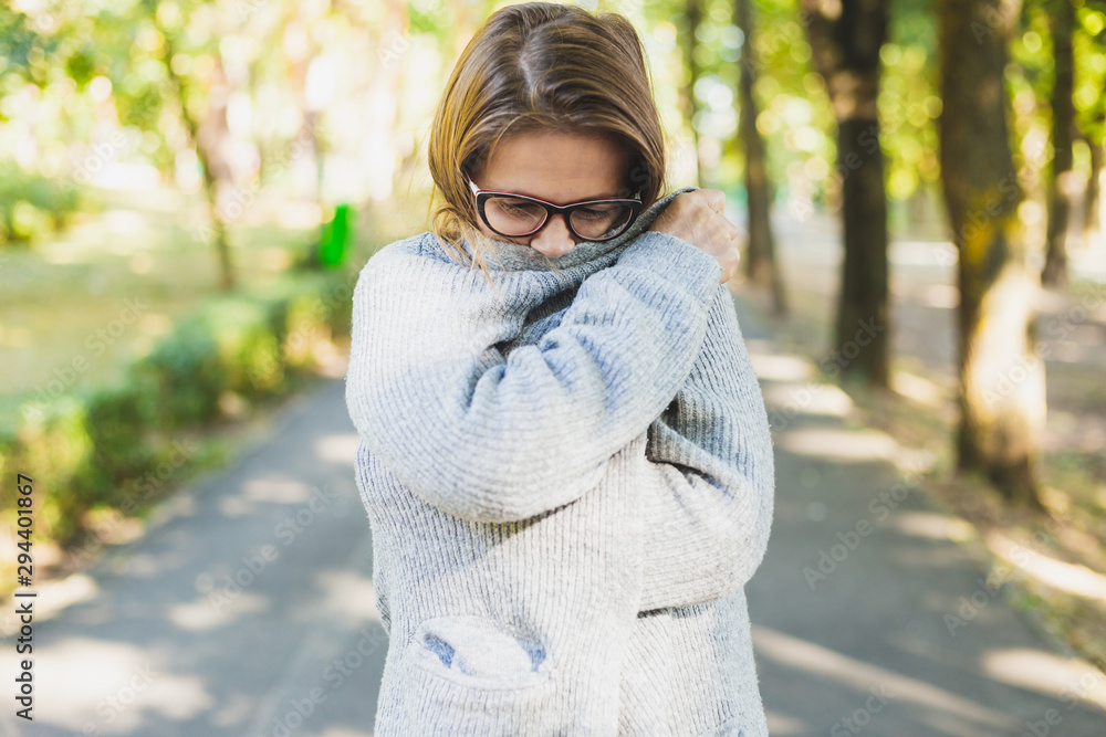 Wall mural woman feeling cold outdoors