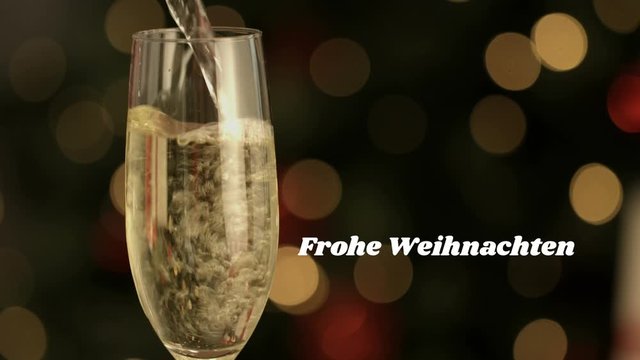 Frohe Weihnachten written over champagne flute