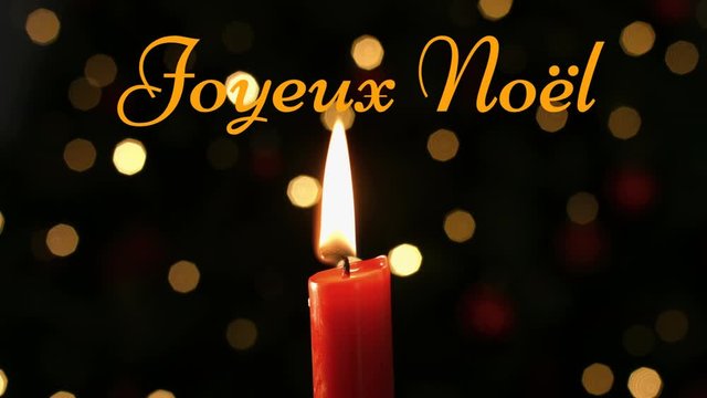Joyeux NoÃ«l written over lit candle