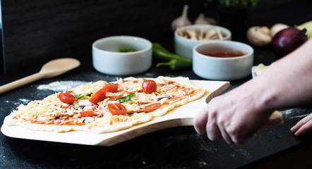making homemade Italian-style pizza