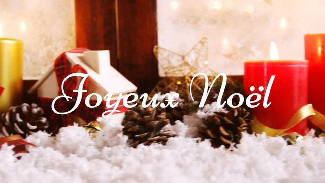 Joyeux NoÃ«l written over Christmas decorations