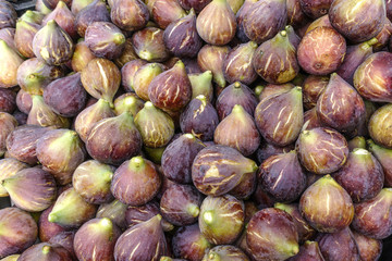 Fresh ripe figs as background.