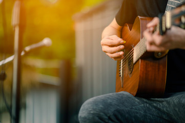Close-up of musicians, guitarists playing blues at outdoor concerts, musical concept.