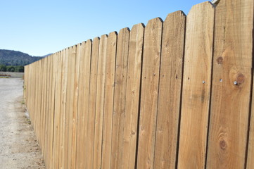 wooden fence on background of blue sky