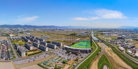Aerial view over huge golf driving range