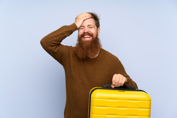 Redhead man with long beard holding a suitcase has realized something and intending the solution