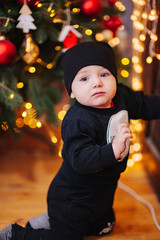 Happy fun child paying at home on Christmas time. Xmas holiday concept