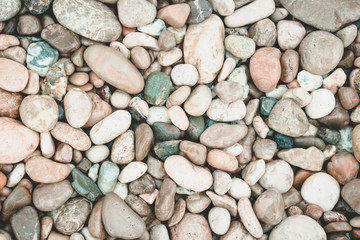 Beautiful background with sea stones. Round colorful sea stones. Background for design.