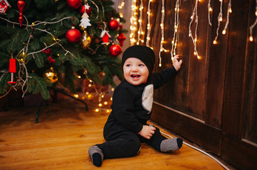 Happy fun child paying at home on Christmas time. Xmas holiday concept