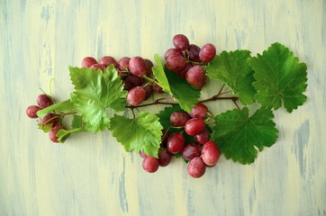 bunch of grapes on wooden background