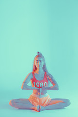 Athletic young woman doing yoga exercise