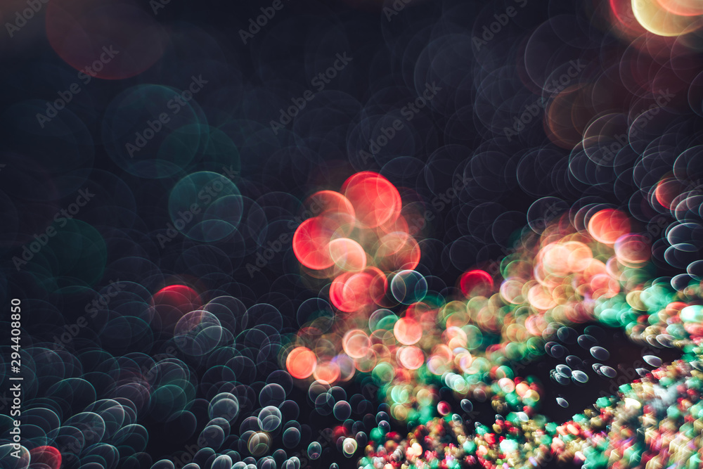 Poster beautiful light bokeh on a red white and darkness background.