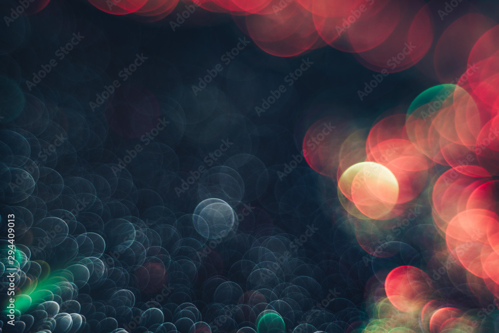 Poster beautiful light bokeh on a red white and darkness background.
