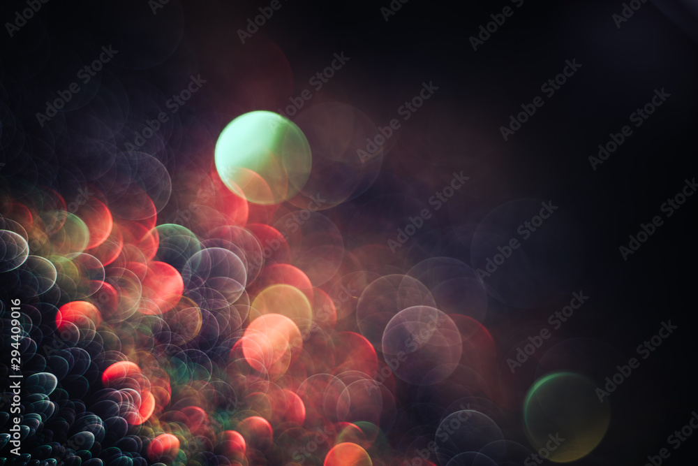 Poster beautiful light bokeh on a red white and darkness background.