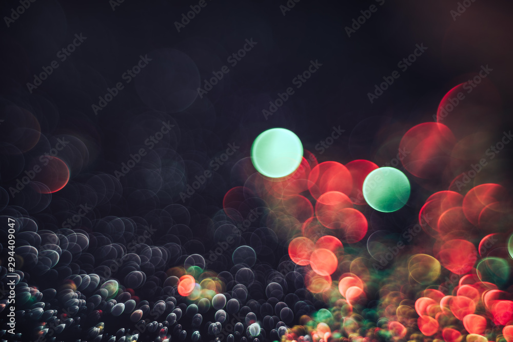 Poster beautiful light bokeh on a red white and darkness background.