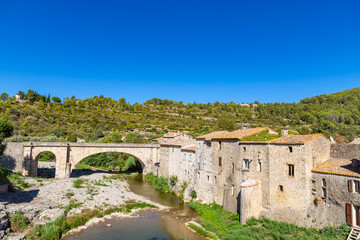 Medieval vaulted arch bridge over Orbieu river in Lagrasse, France