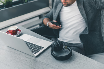Young beard man using laptop on office, freelance work, outdoor close up hipster portrait, brutal,...