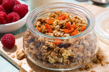 homemade granola with dried apricots and nuts, closeup